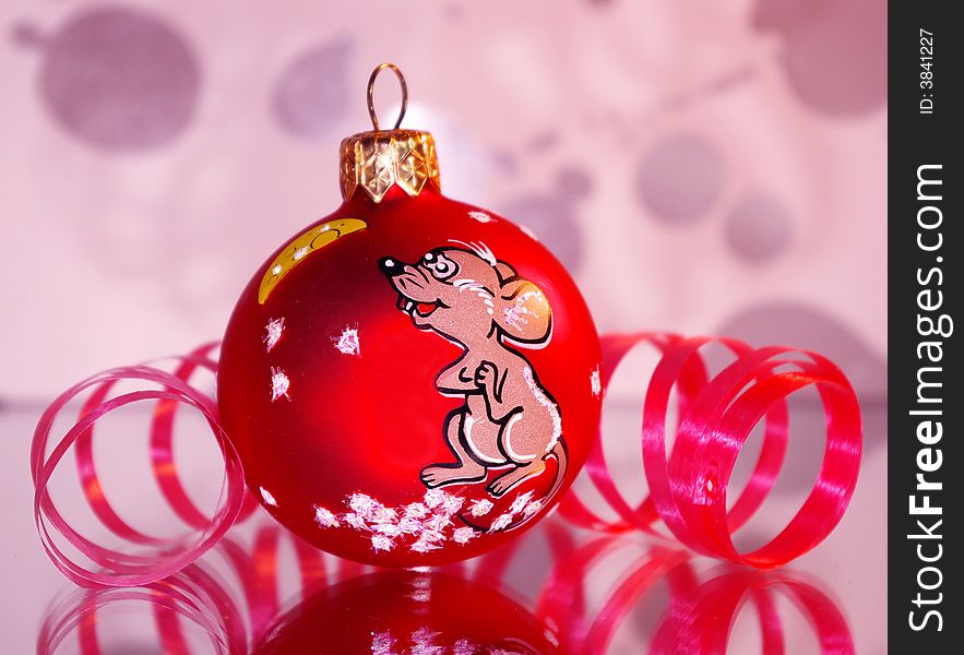 Christmas decoratioт red ball with rat and cheese