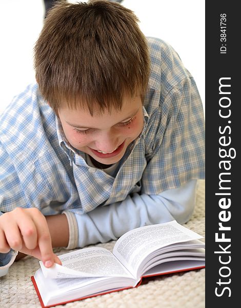 Boy learning on the floor, very excited