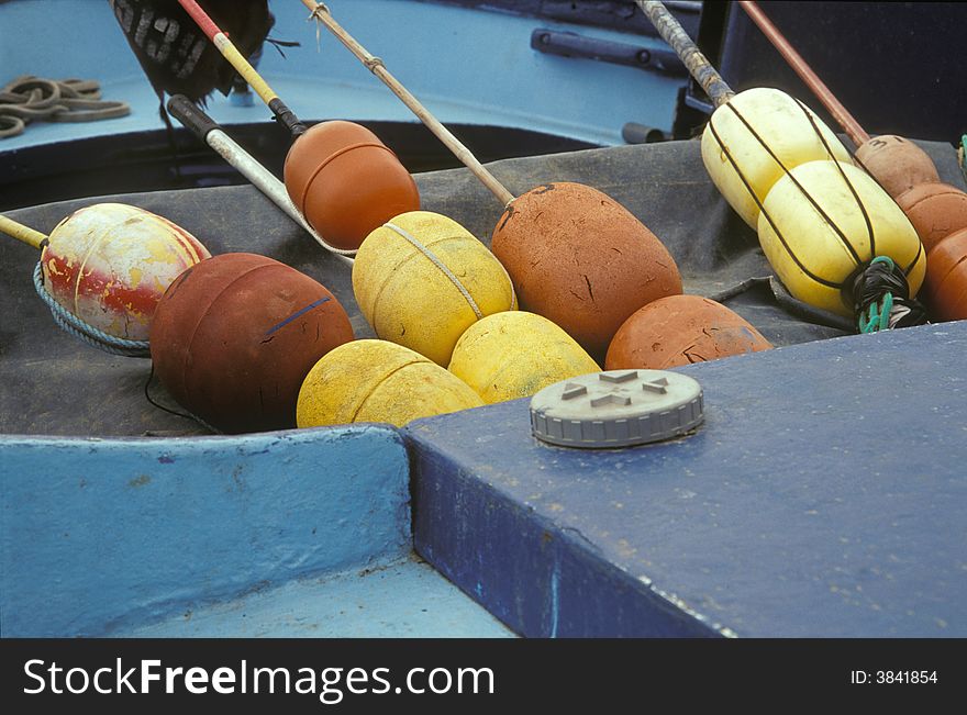 Buoys for fishing lying in a blue painted boat in the harbour of south France