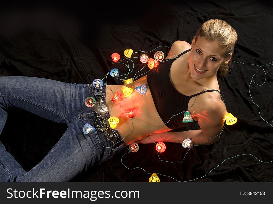 Sexual young woman with christmas lights