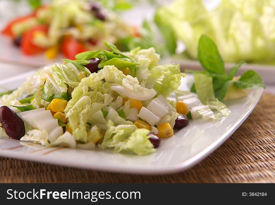 Fresh vegetarian salad with corn and basil