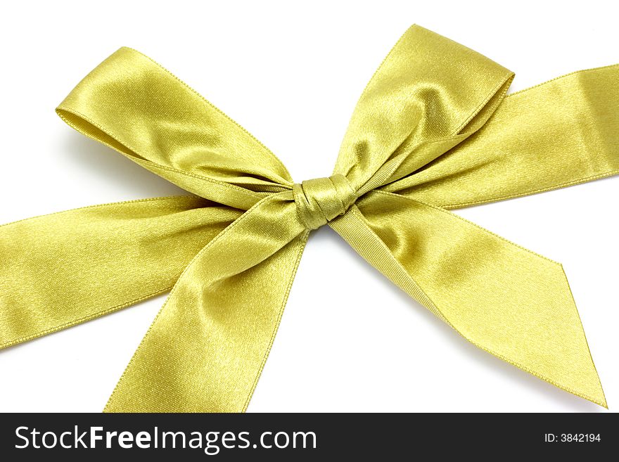 Golden ribbon with bow isolated on white