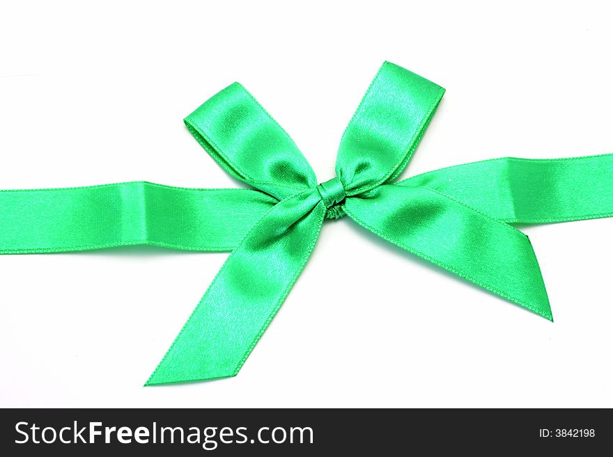 Green ribbon with bow isolated on white