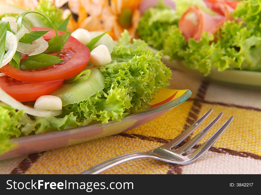 Fresh salad with onion, tomato, basil and cucumber. Fresh salad with onion, tomato, basil and cucumber