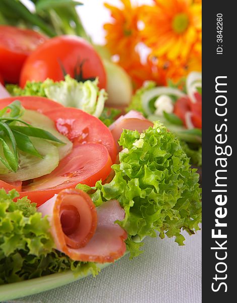 Fresh salad with onion, tomato and basil