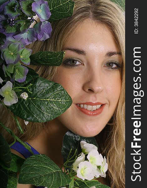 Gorgeous Woman Headshot In Flowers Upclose