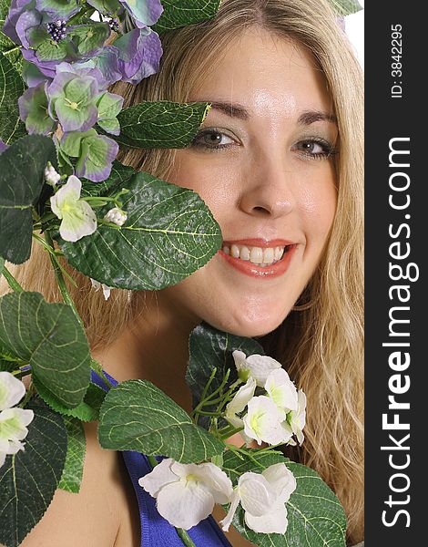 Shot of a gorgeous woman headshot in flowers