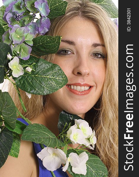 Woman in flowers smiling having a great day