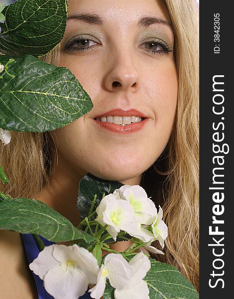 Image of a womans face in a flower headshot