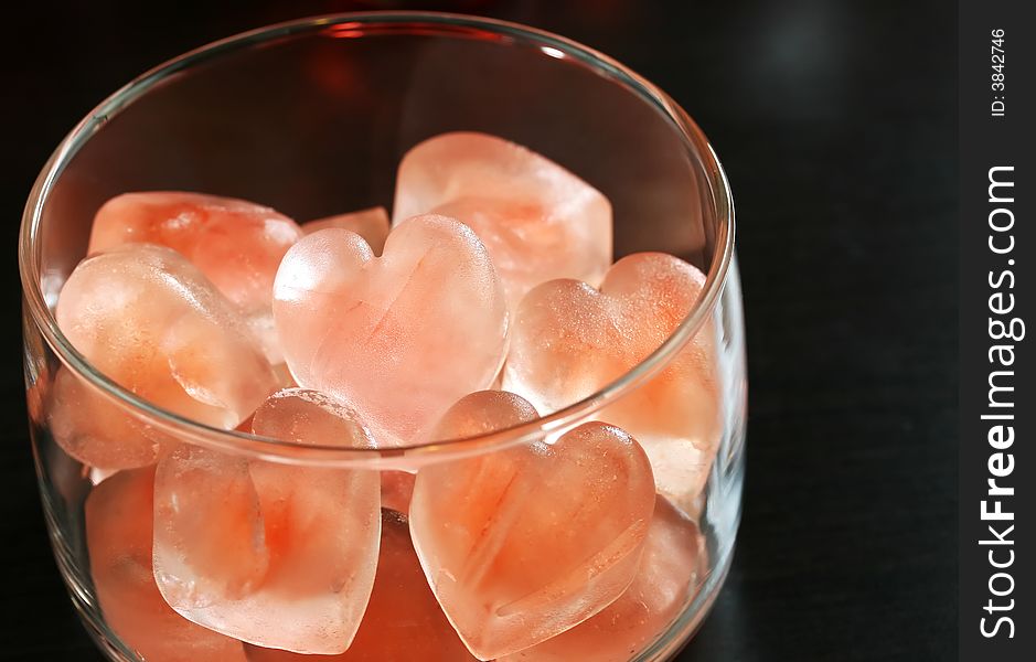 A bowl of heart shaped ice cubes for valentines day cocktailes