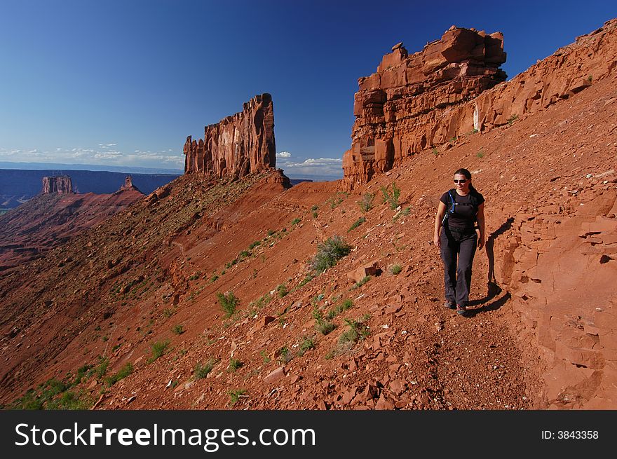 Woman hiking near Castleton Tower near Moab Utah. Woman hiking near Castleton Tower near Moab Utah