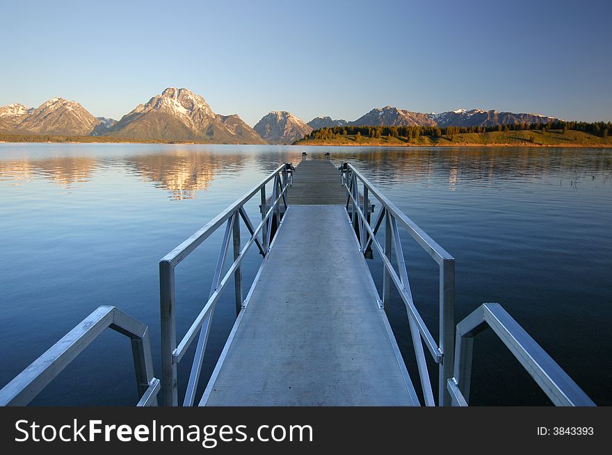 Docks extending into Teton Lake in the Grand Teton National Parkl, Wyoming. Docks extending into Teton Lake in the Grand Teton National Parkl, Wyoming