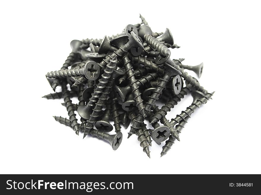 Heap of screws isolated on white background.