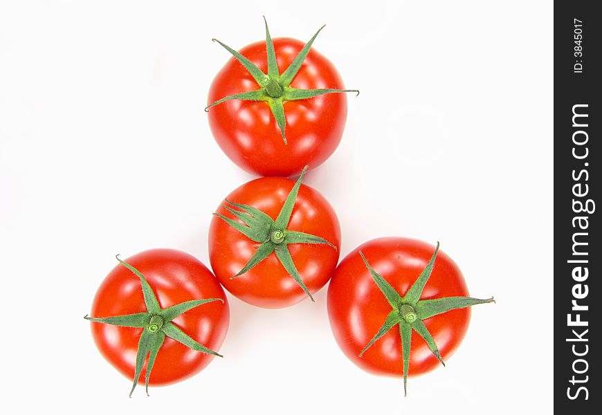 Isolated fresh tomatoes with stems closeup (vivid colors)