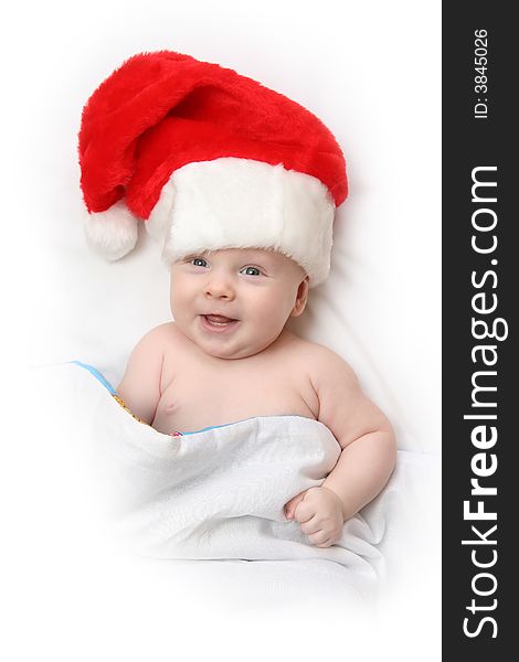 The Child in red hat of Santa on white background. The Child in red hat of Santa on white background.
