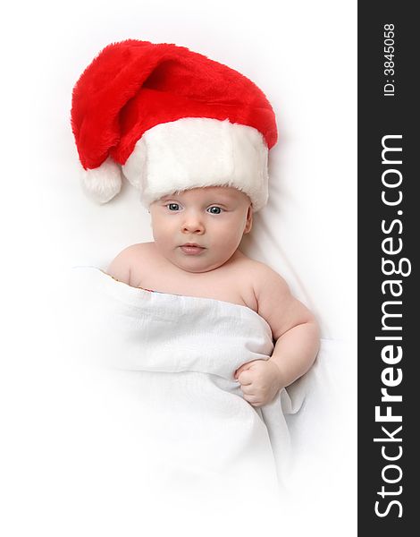 The Child in red hat of Santa on white background. The Child in red hat of Santa on white background.