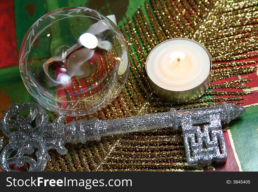 A christmas ornament arranged on festive background holiday paper. A christmas ornament arranged on festive background holiday paper