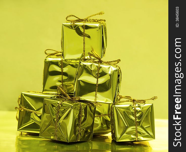 Stack of golden gift boxes