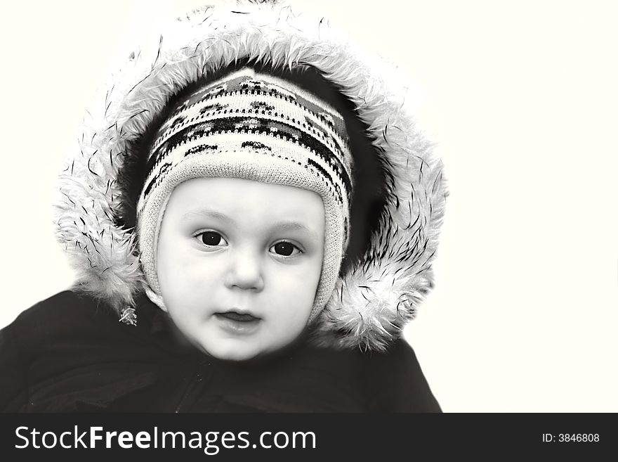 Portrait of a baby boy in warm jacket over white. Portrait of a baby boy in warm jacket over white