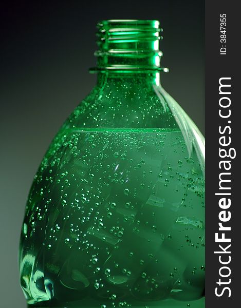 Green plastic bottle with water