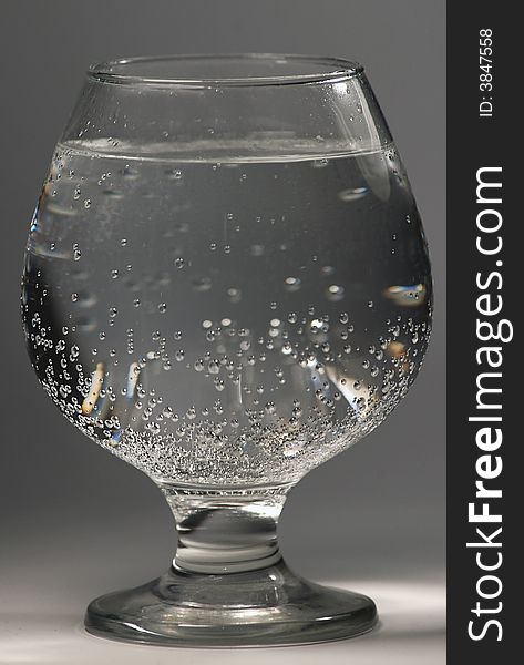 Glass with water on a white background