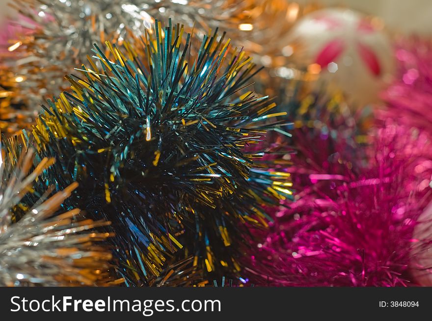 Christmas tree tinsel and Christmas tree ball on background. Christmas tree tinsel and Christmas tree ball on background