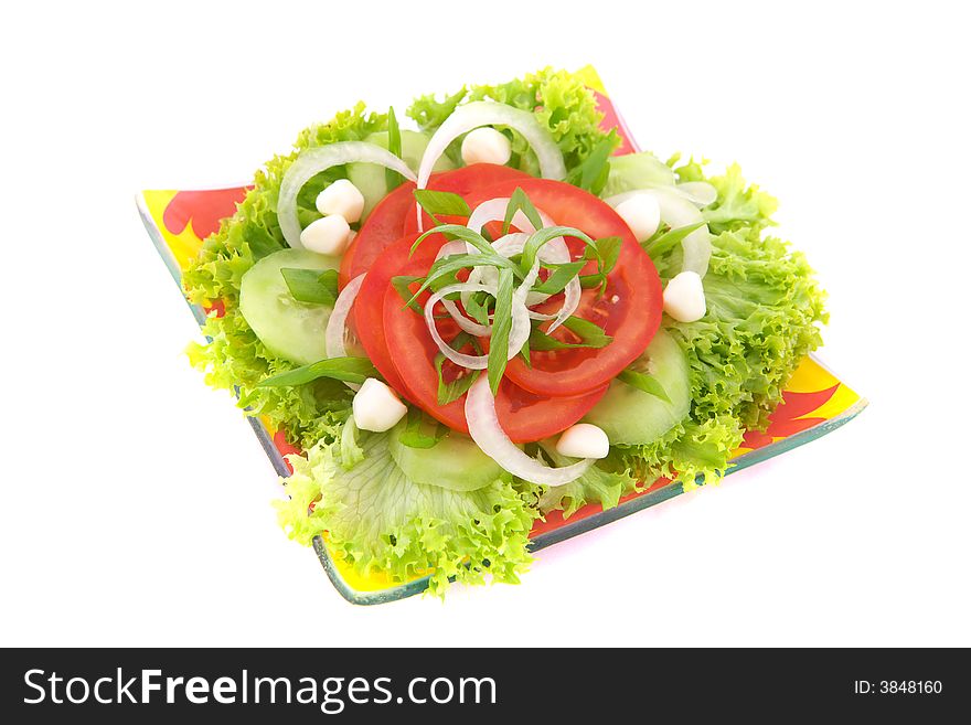 Fresh salad with onion, tomato and basil