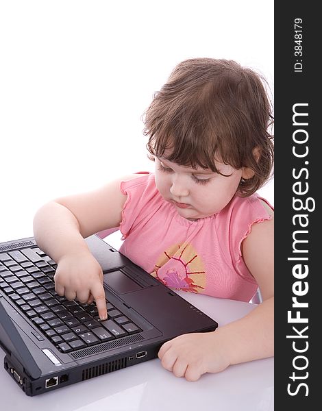 Child looks at laptop