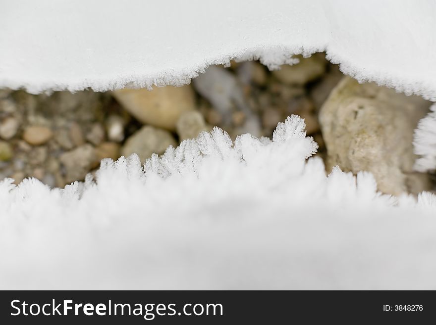 Ice crystals and pebbles, outdoor photo