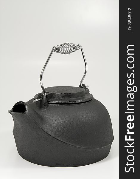 Iron kettle on a white background