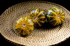 Three Striped Pumpkins On Wickerwork Plate Stock Photo Three Striped Pumpkins On Wickerwork Plate Stock Photo