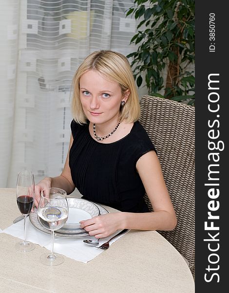 Beautiful woman at the table in a restaurant