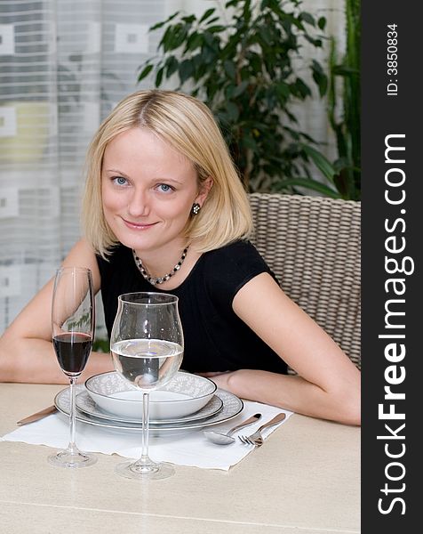 Beautiful woman at the table in a restaurant