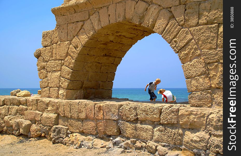 Kids at roman aqueduct ruins