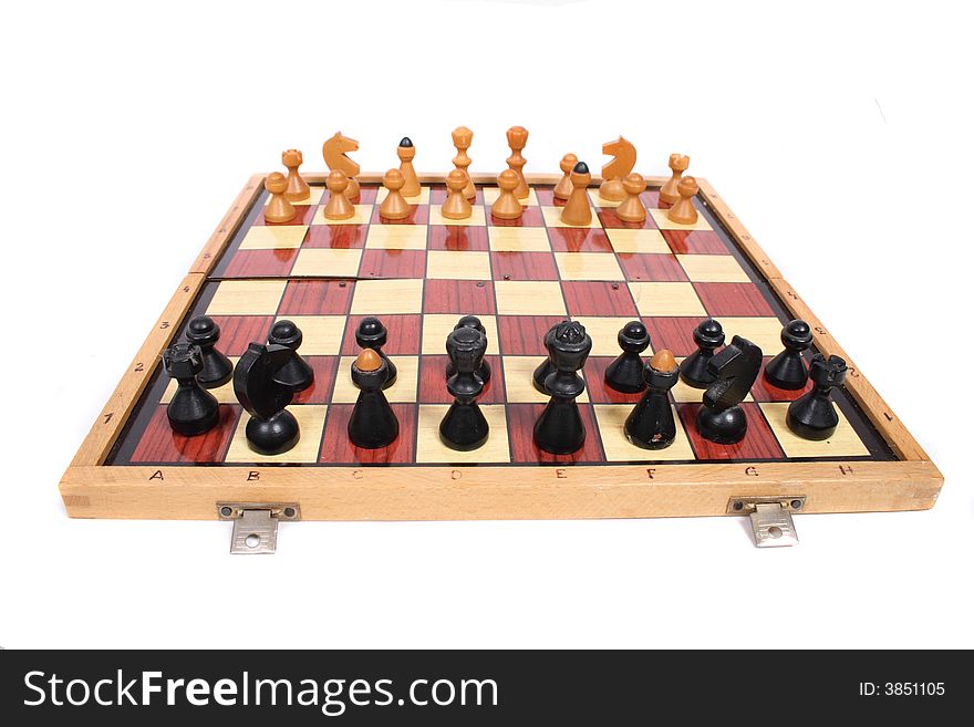 Old chess set on the white background