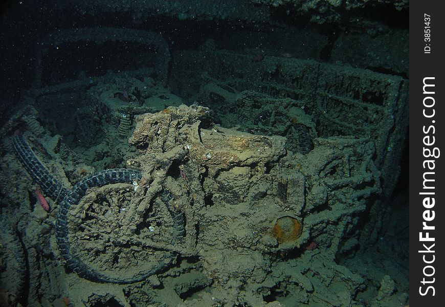 BSA motorcycle inside of cargo hole in Thistlegorm wreck, 4 bikes on top of platform of Bedford Truck Red Sea, Egypt. BSA motorcycle inside of cargo hole in Thistlegorm wreck, 4 bikes on top of platform of Bedford Truck Red Sea, Egypt