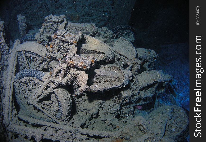 BSA motorcycle inside of cargo hole in Thistlegorm wreck, 3 bikes on top of platform of Bedford Truck Red Sea, Egypt. BSA motorcycle inside of cargo hole in Thistlegorm wreck, 3 bikes on top of platform of Bedford Truck Red Sea, Egypt
