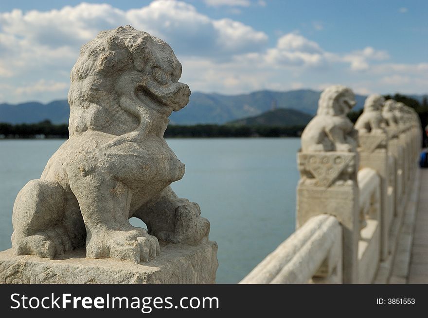 In the Summer Palace, these 544 carved white marble lions, in distinctive postures, sit at the column of the parapets on the 17-arch Bridge, which looks like a rainbow arching over the lake water. 
Beijing, China