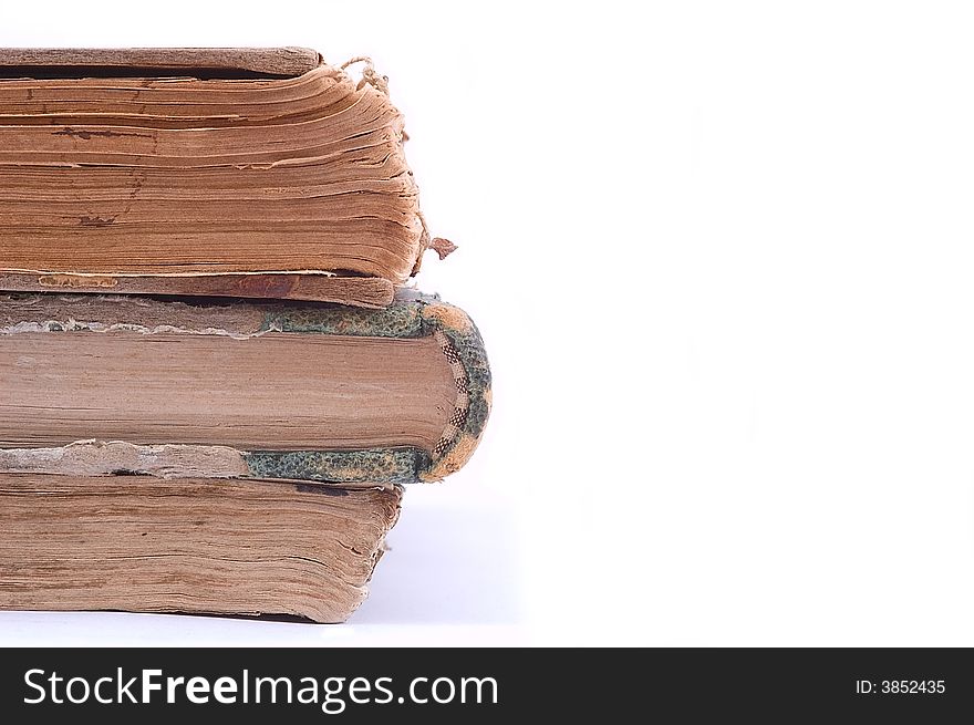 Three ancient vintage books isolated on white background. Halb view. Three ancient vintage books isolated on white background. Halb view.