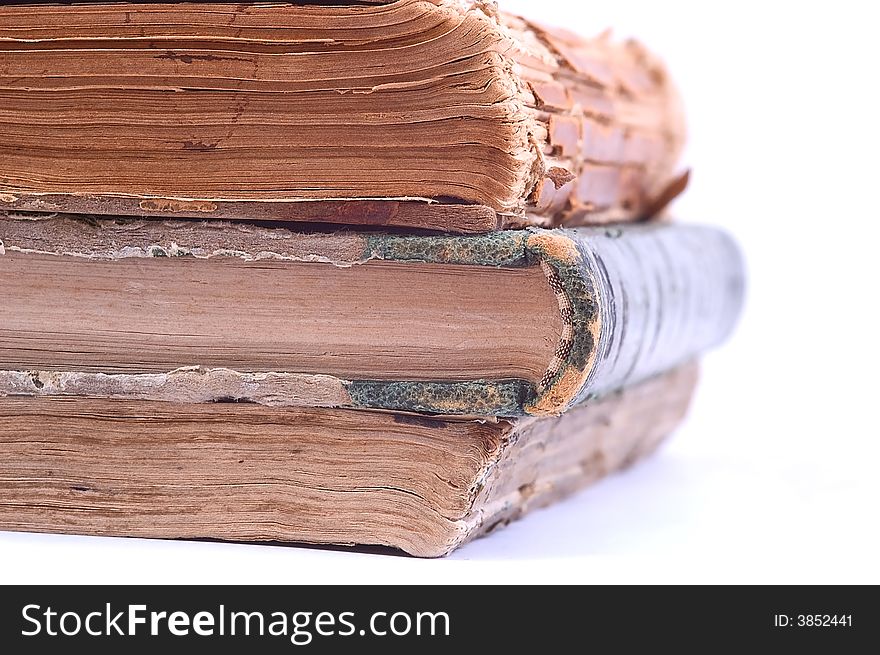 Three ancient vintage books isolated on white background. Halb view. Three ancient vintage books isolated on white background. Halb view.