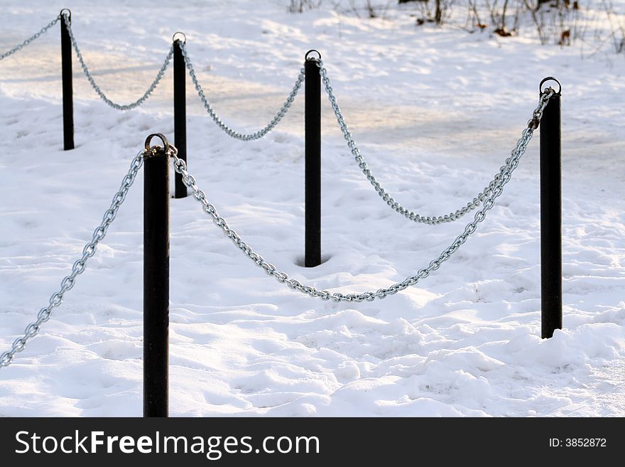Fence of the chain on the snow. Fence of the chain on the snow