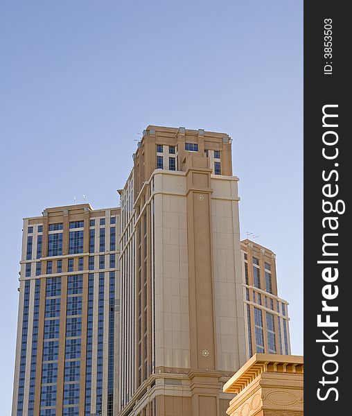 A colorful hotel against a blue sky. A colorful hotel against a blue sky