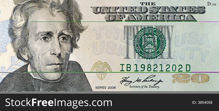 Macro shot of a 20 dollar bill, includes Andrew Jackson's portrait.