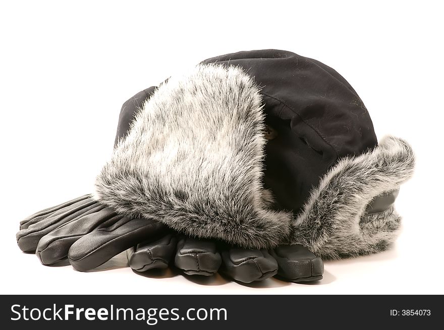 Warm gloves and winter biggin on white background. Warm gloves and winter biggin on white background