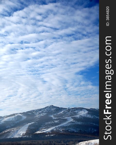 Ski slope under the light cloudy sky. Ski slope under the light cloudy sky