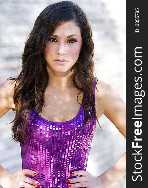 Beautiful  woman in purple sequined top