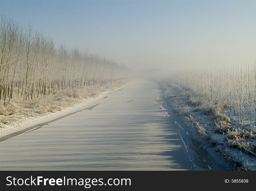 The main aqueduct for irrigation is frozen in extreme cold. Everything is in white. The main aqueduct for irrigation is frozen in extreme cold. Everything is in white.