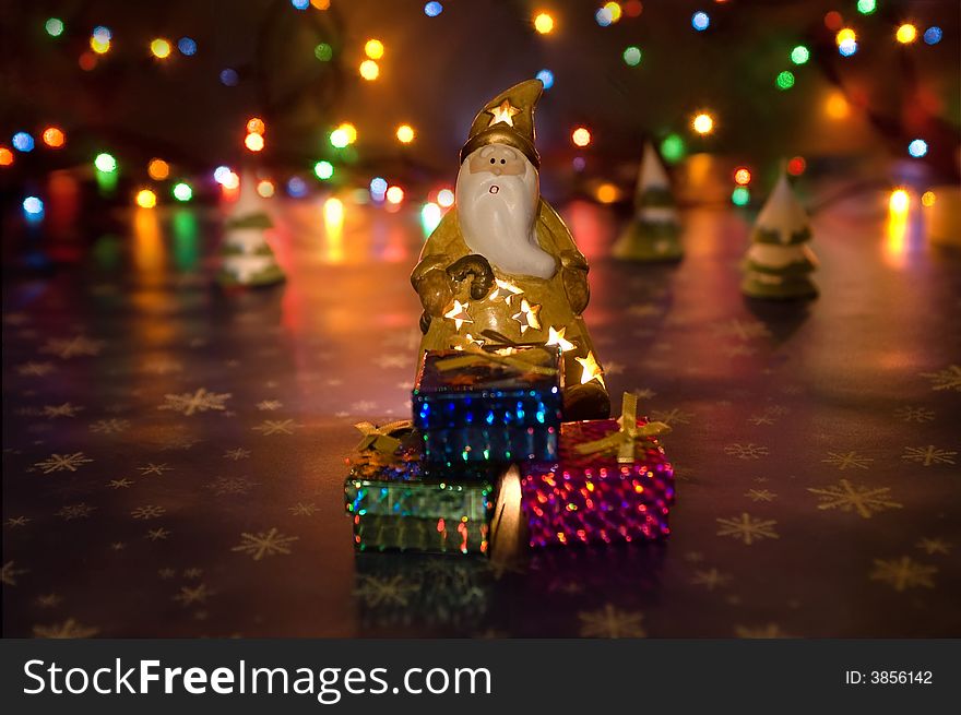 Santa Claus with presents and garland lights