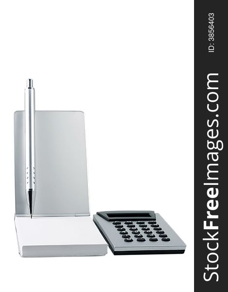 Silver calculator and metal pen. Silver calculator and metal pen