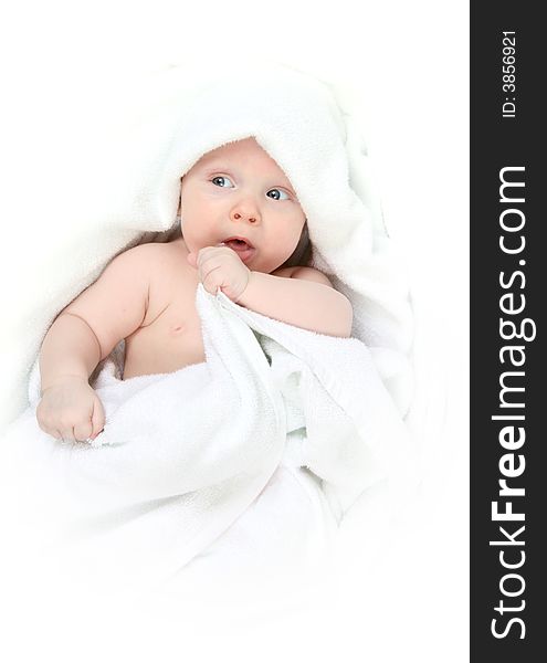 Tot under towel on white background.